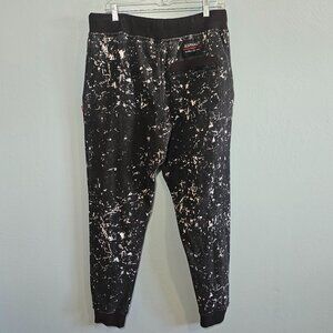 Asphalt street-style joggers in black/white paint splatter, Large